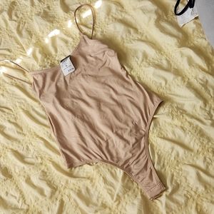 Nude thong bodysuit. NWT